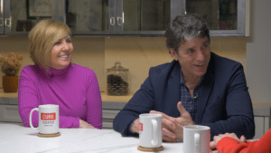 Mike and Kim Adamle smiling as they are being interviewed for an episode of Seizing Life, a CURE podcast