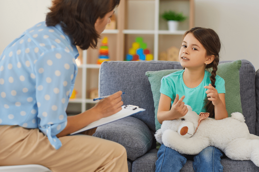 Adult evaluating a young girl