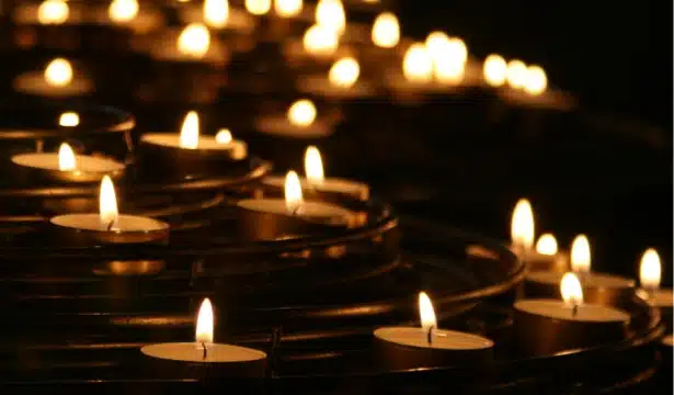 Candles lit in a dark room