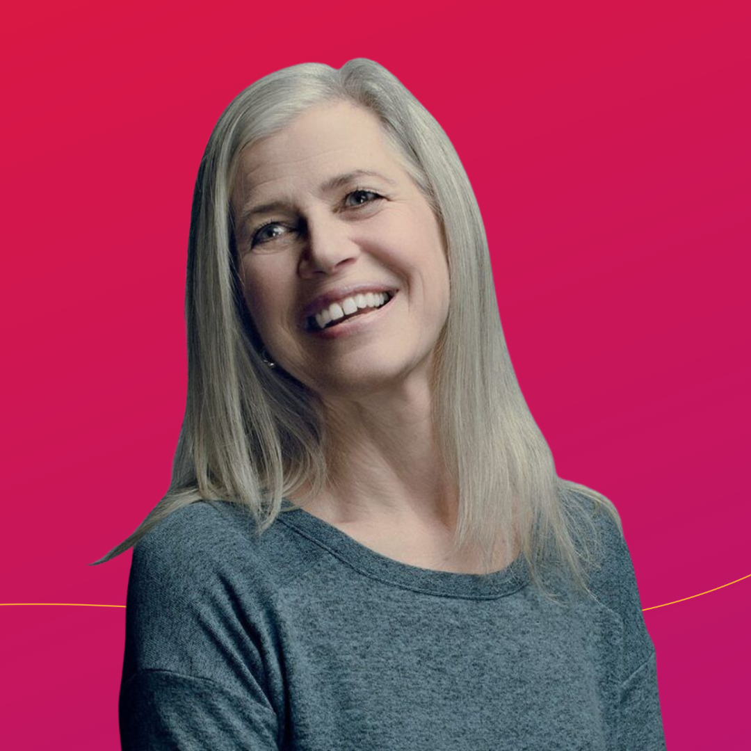 CURE Epilepsy founder, Susan Axelrod, smiling on a red and purple background.